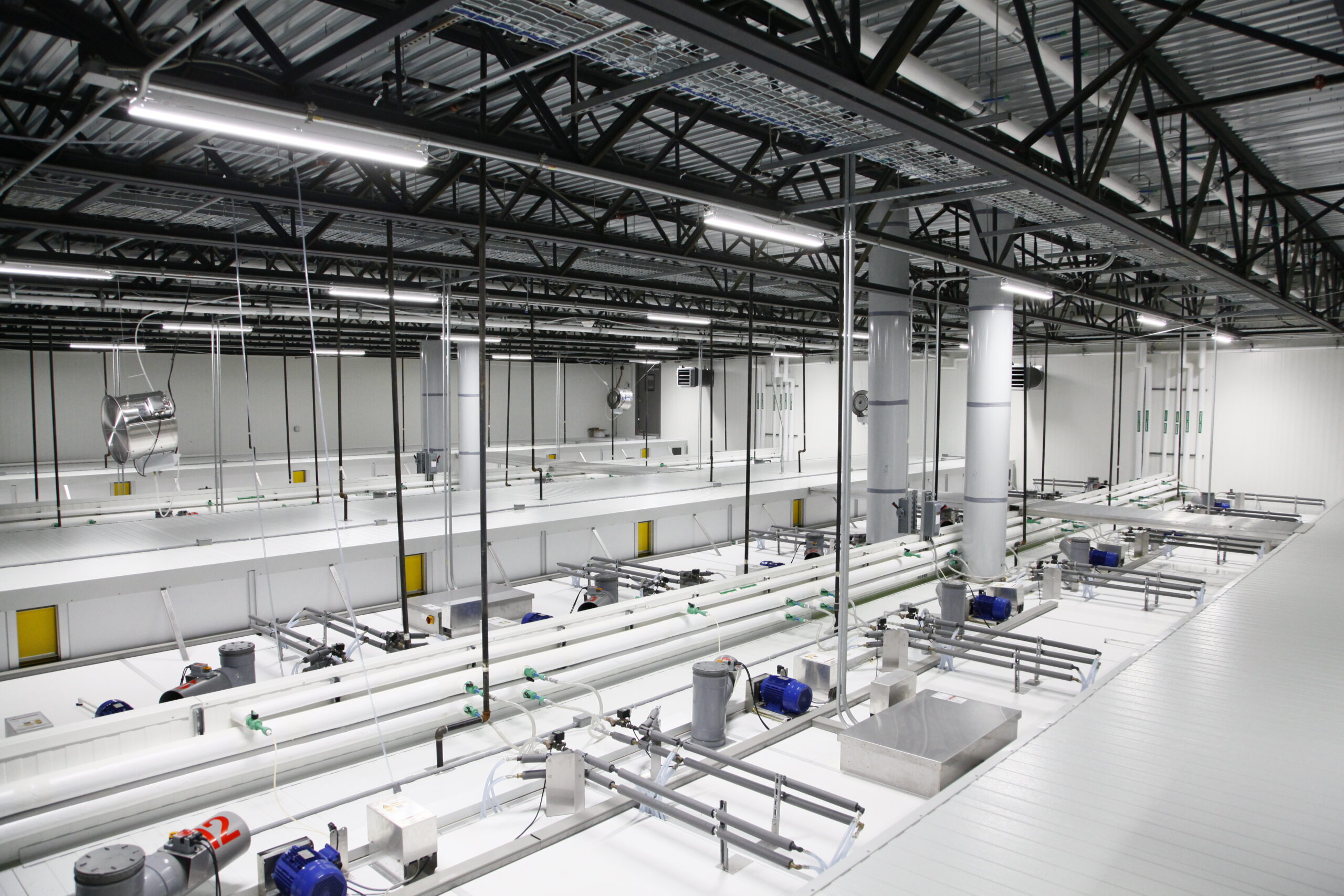 Interior view of a turnkey agricultural building featuring full installation by Dutch Farm Design